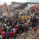 Rescuers use excavators to search for victims under the rubble of collapsed buildings after an earthquake in Pidie Jaya, Aceh province, Indonesia. (Image: AP/Heri Juanda)